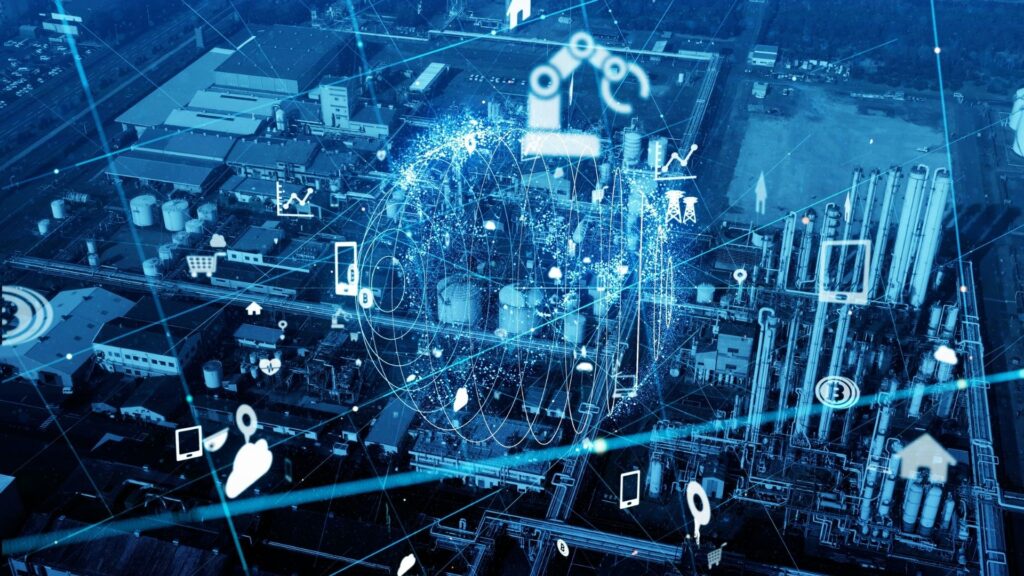 Aerial view of an industrial complex with digital overlay, featuring a robotic arm, globe, and icons for connectivity, representing smart industry technology.