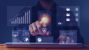 Data Analytics vs Data Science: Which Role Does Your Business Actually Need? Alt: Person interacting with holographic data dashboards on laptop: charts, AI, security, cloud config, global analytics.