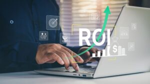 Business professional using laptop with holographic ROI analytics icons and upward trending arrow; analytics ROI calculation guide.